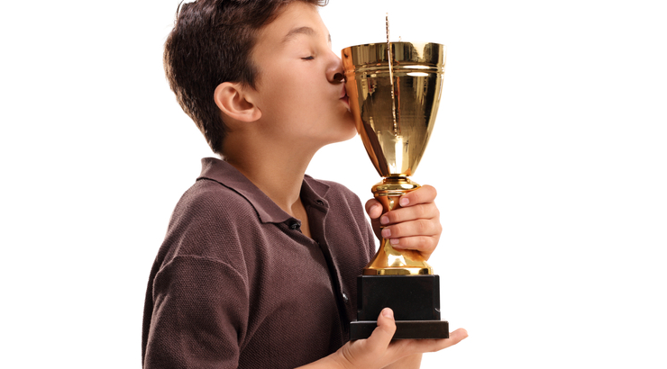 Youth Soccer News - Are we praising our kids too much? Love of soccer trophies can start when kids are young