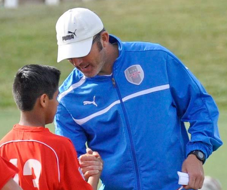 Albion SC’s Noah GIns speaks with a player before California Regional League soccer match