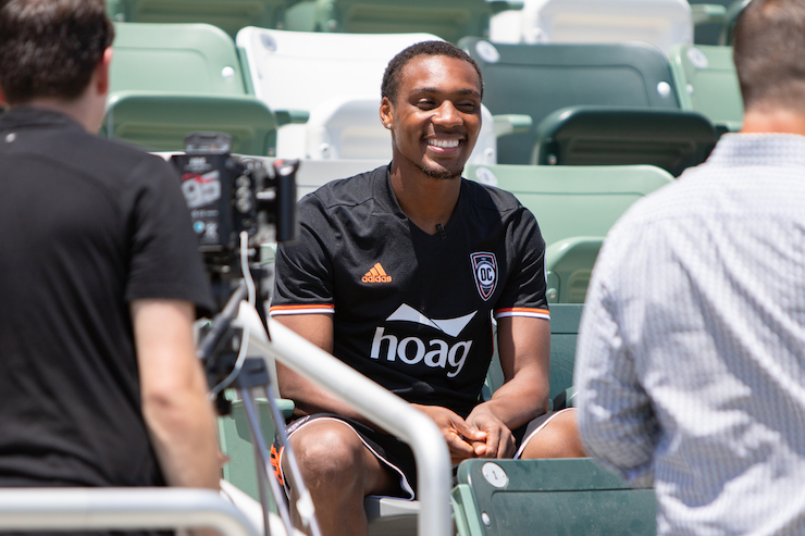 Michael Seaton with a camera in his face - OCSC Behind the Scene