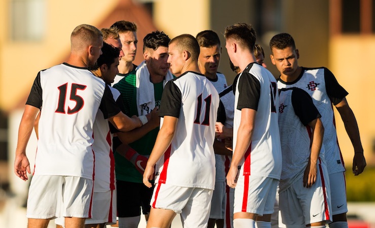 09 September 2018: San Diego State defensemen Miles Stray (13) is congratulated by teammates after scoring the equalizing goal in the eighty-fifth minute. The San Diego State men's soccer team beat UC Irvine in overtime 2-1 Sunday afternoon at the SDSU Sports Deck.