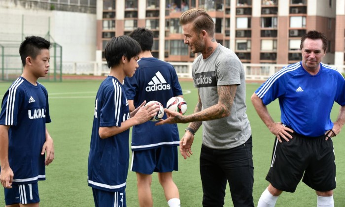 Tom Byer, author of Soccer Starts at Home with David Beckham. Both are training youth players together