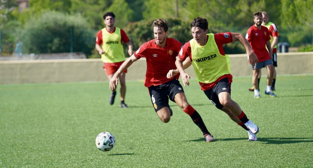 International Soccer Academy's 19-year-old Creighton Braun battles for the ball with teammate Michael Scavuzzo